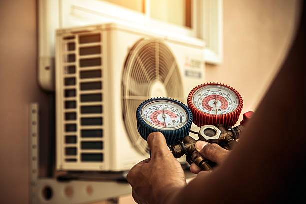 Professional Air Conditioning Service technician working in Gales Ferry, CT